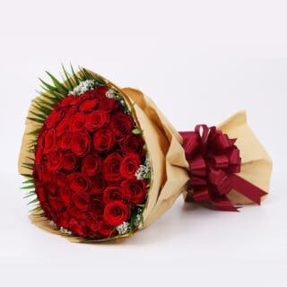 A luxurious display of 50 red roses, accented with delicate gypsophila and rich greenery, beautifully wrapped in brown and adorned with a maroon ribbon.