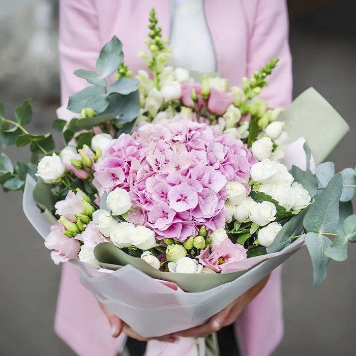 ethical_beauty.jpg Pink hydrangea bouquet with white roses and eucalyptus.