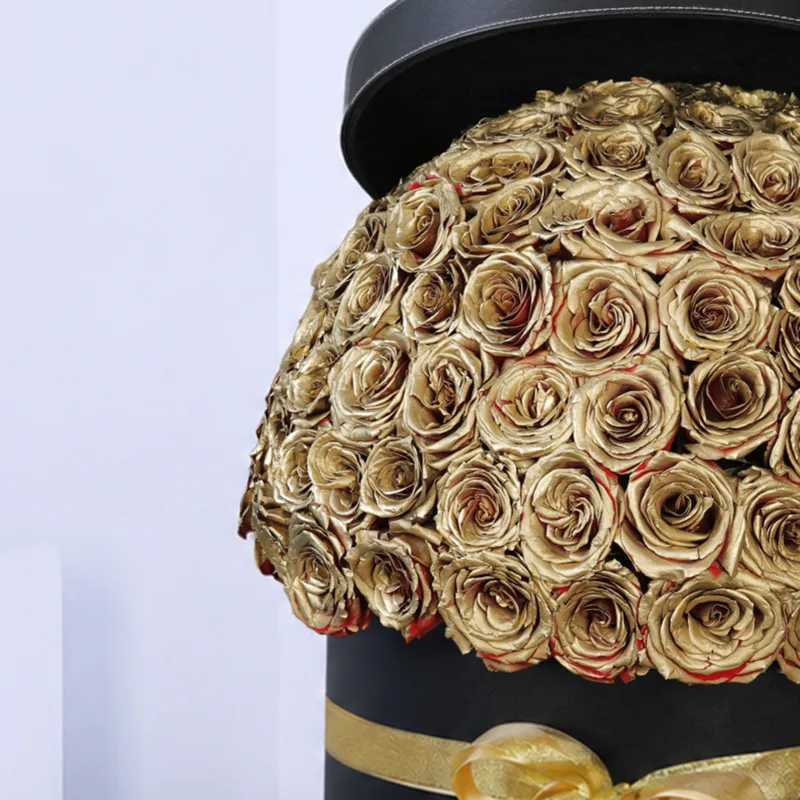 golden sprayed roses in a black box 03