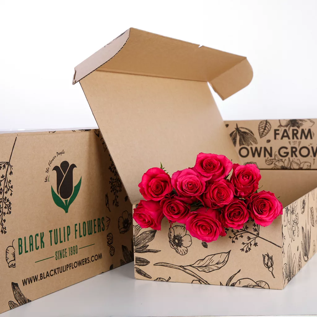 Rose Dark Pink (3) A bunch of dark pink roses in a sustainable brown box with flower food.