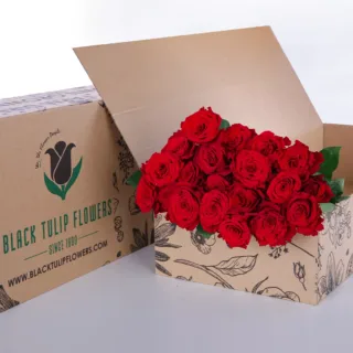 A vibrant bunch of premium red roses in a brown box, perfect for creating stunning arrangements.