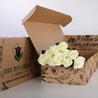 10 stems of elegant white roses in a brown box, ideal for any arrangement, accompanied by flower food.