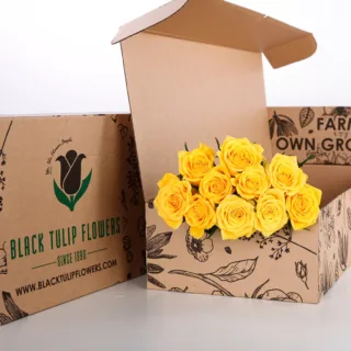 Bunch of 10 stem yellow roses in a brown box accompanied by flower food.
