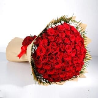 100 stem red roses with Gypso and added greenery in abrown wrap tied with red ribbon.