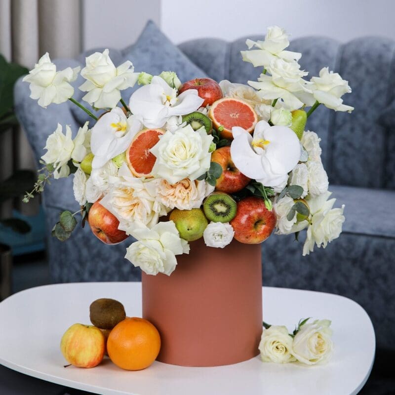 Peaceful Fruit (1) Peaceful Fruit Arrangement composed of mix fruits and flowers in a box by Black Tulip Flowers.