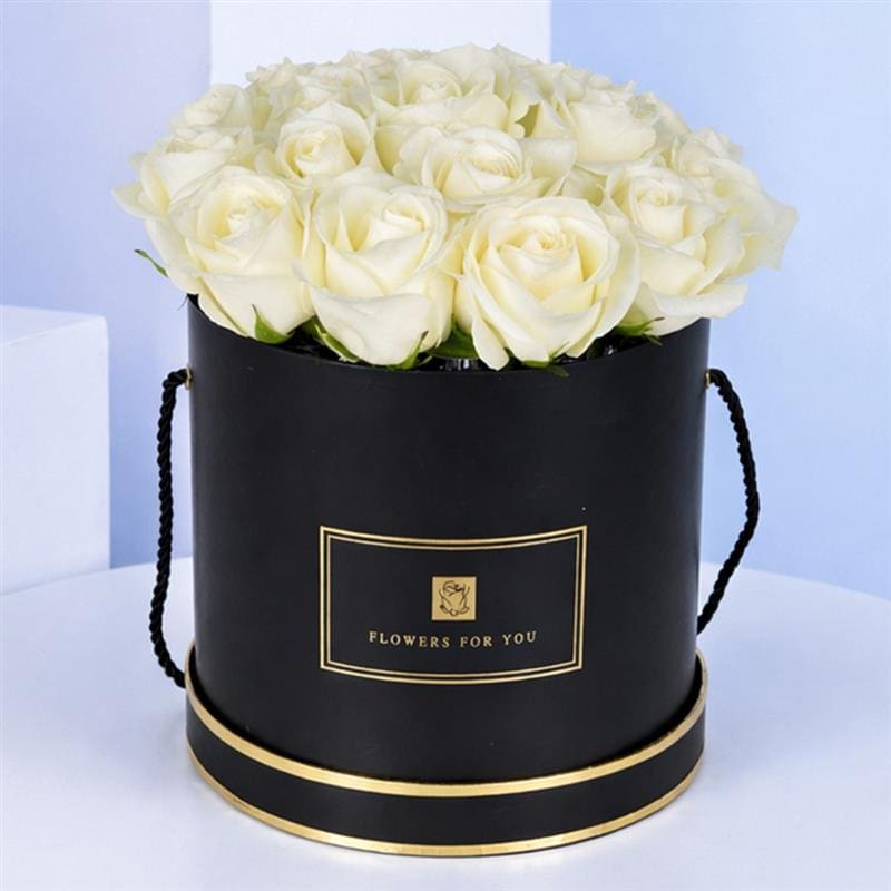 reverence-white-2026_01 Beautifully arranged 20-stem white roses in a convenient, easy-to-carry black box.