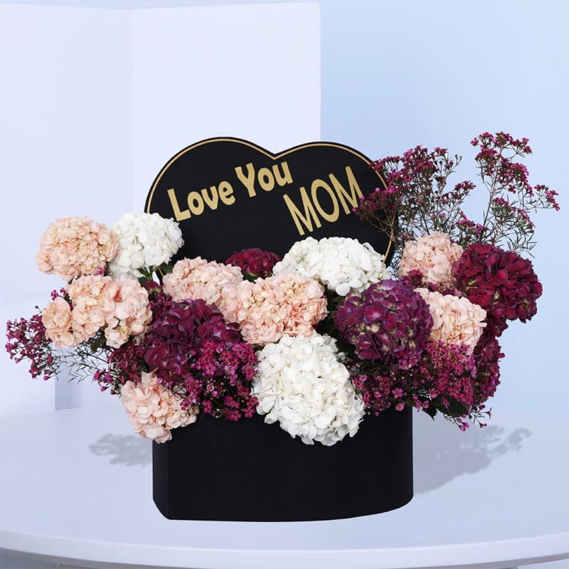01 Heartfelt Mother's Day gift basket with mixed colorful hydrangeas and a "Love You Mom" card.