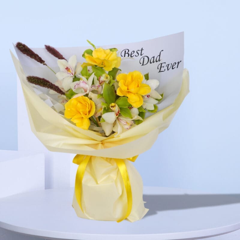A bright bouquet of yellow roses and white orchids with a "Best Dad Ever" card.
