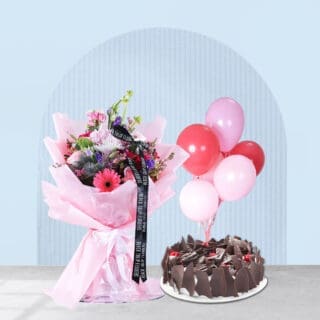 Pink flower bouquet, balloons, and cake for a special birthday.