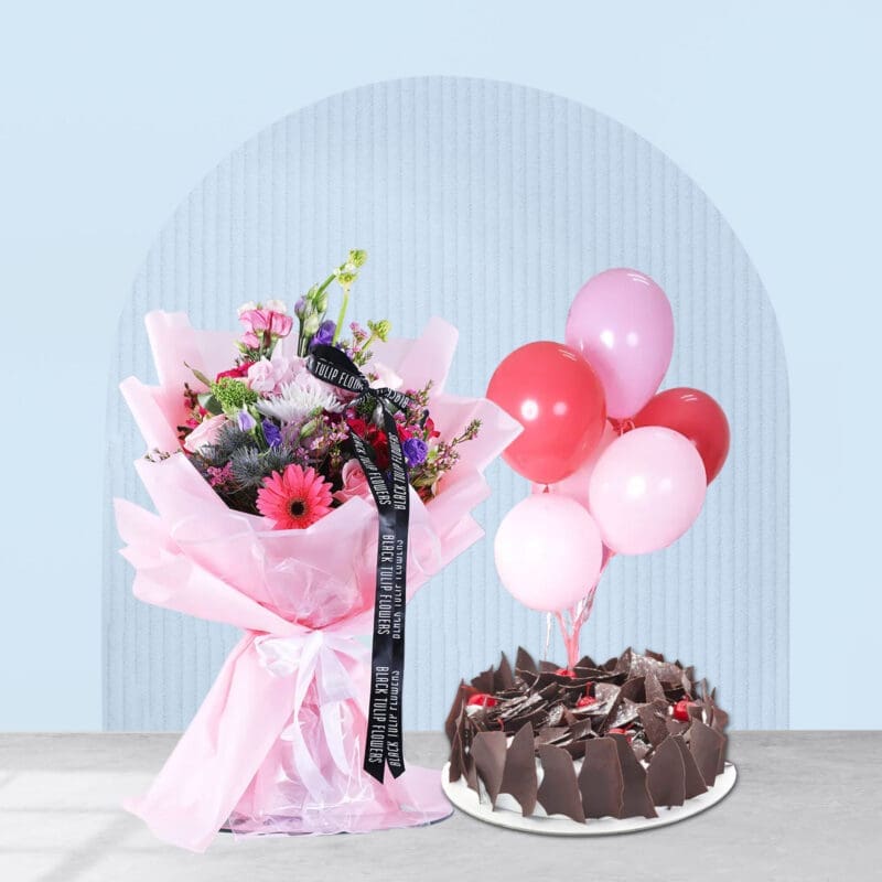 Pink flower bouquet, balloons, and cake for a special birthday.