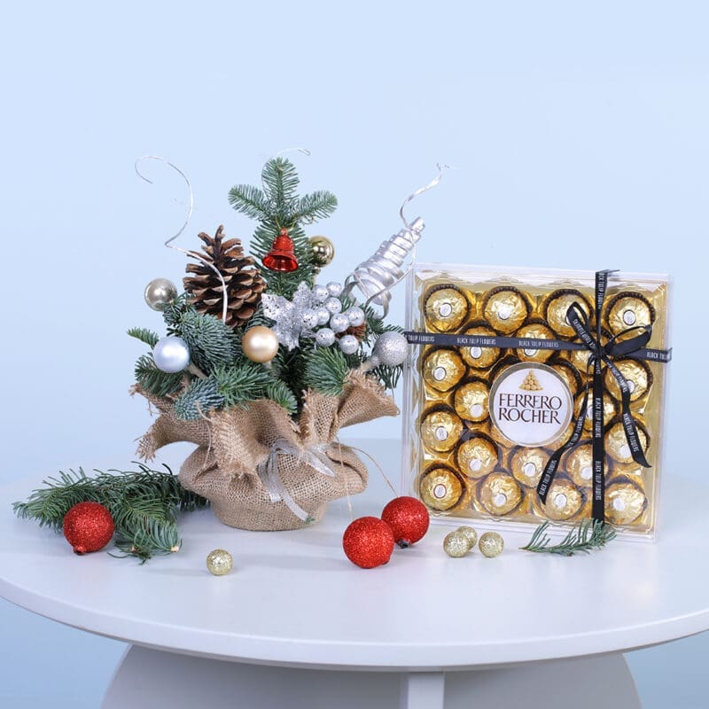 01 Festive Christmas gift set with a mini Christmas tree and a box of Ferrero Rocher chocolates.