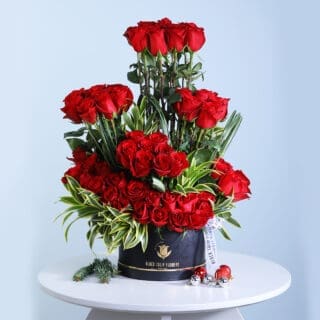 Luxurious 70-Stem Red Roses Centerpiece with Beautiful Green Leaves – Ideal for Romantic and Formal Celebrations