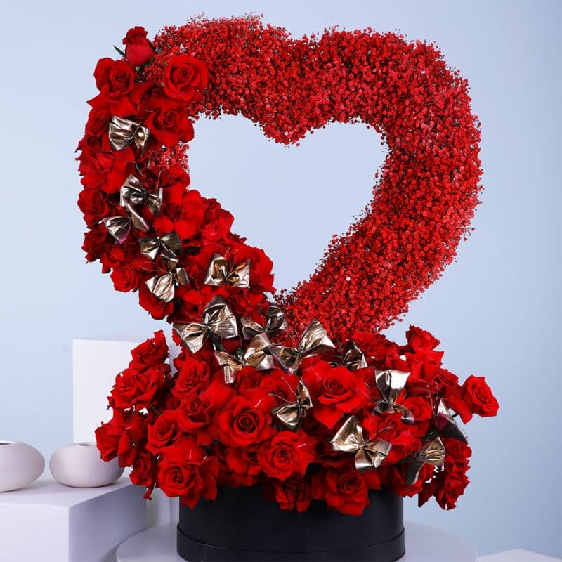 01 Standing heart shape deep love flower box arrangement, featuring red roses, and red sprayed gypsophilla in a black box.