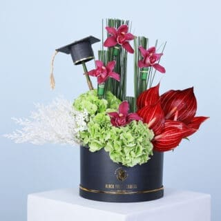 Graduation flower gift with hydrangeas, anthuriums, 4 cymbidium, and steel grass