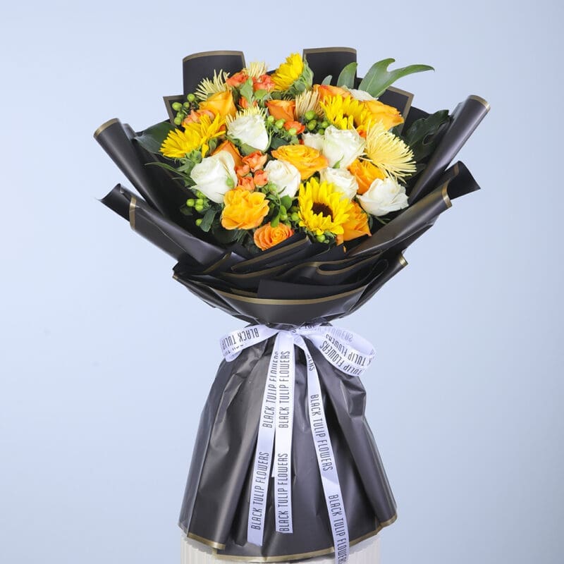 Click to enlarge image Sunflower Sensation, a sunshine theme bouquet in a black wrap