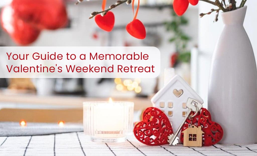A Valentine's Day themed image with a candle, decorative hearts, a small house figurine, and keys. The text "Your Guide to a Memorable Valentine's Weekend Retreat" is displayed above the image