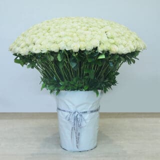 Explore our elegant collection of white blooms in a large vase, perfect for weddings, anniversaries, and luxurious decor.