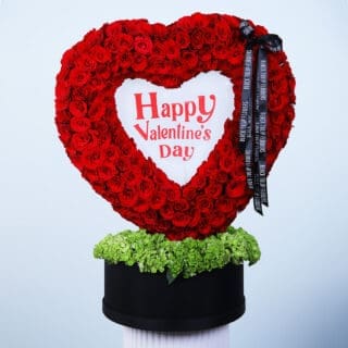 Heart-shaped arrangement of 300 roses with green hydrangeas in a black box, featuring the message "Happy Valentine’s Day.