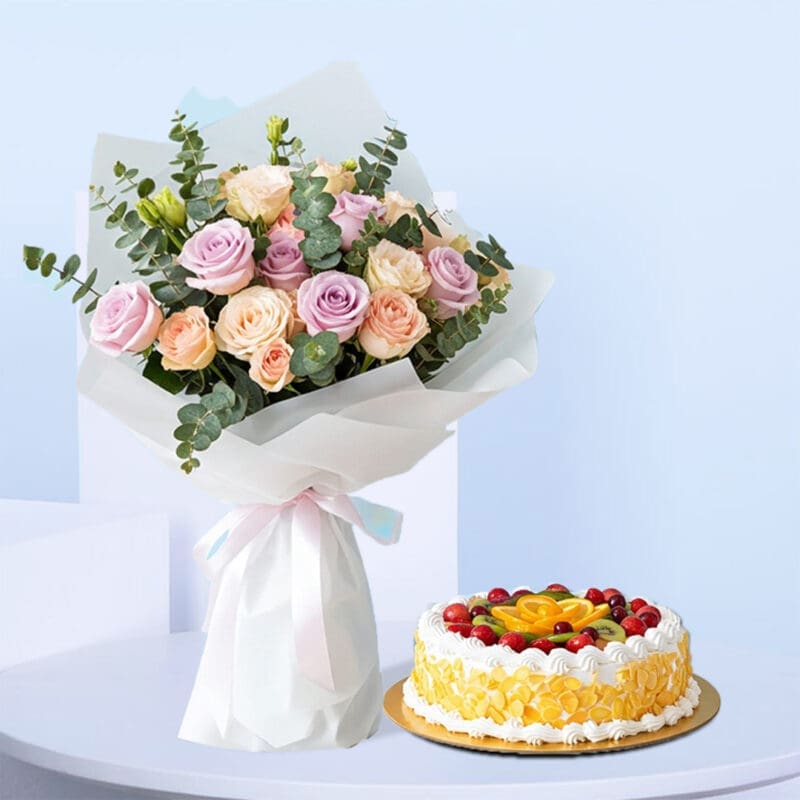 mixed-roses-fruit-cake-01 A bouquet of pastel pink, lavender, and peach roses, with green eucalyptus, wrapped in white with a light pink and blue ribbon. A round fresh fruit cake, decorated with whipped cream and colorful fruits.