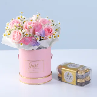 Paired with Ferrero chocolates, the arrangement highlights decorative butterfly and pink roses accented for an elegant and visually striking presentation.
