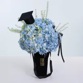 A beautiful hydrangea bouquet symbolizing graduation, showcasing elegance and fresh floral beauty for a memorable celebration.