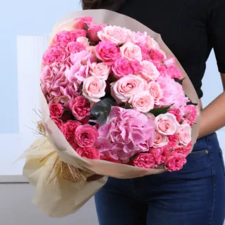 A bouquet of fresh Pink Roses beautifully arranged in a hand-tied style, perfect for gifting and special occasions.