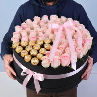 A beautiful arrangement of fresh roses paired with fine chocolates, offering visual charm and indulgent taste in one gift.