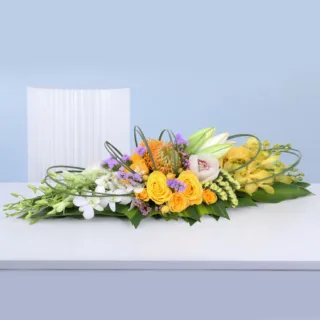 Luxury table centrepiece with layered mixed floral arrangement designed for elegant event décor and premium table styling.
