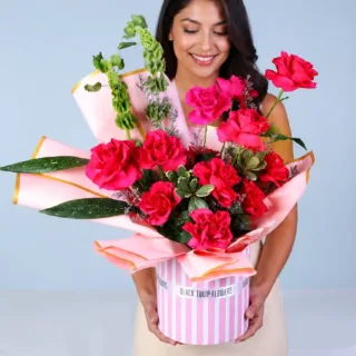 Flower Delivery Sharjah 17 A preserved rose in an elegant box, symbolizing enduring love and sophistication in gifting.