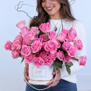 The white round box featuring fresh pink roses elegantly arranged in a premium round box for romantic gifting and special occasions.