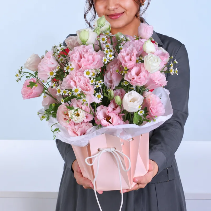 pink-lisianthus-floral-wrap Pink Lisianthus Floral Wrap featuring light pink lisianthus and white tanacetum beautifully arranged in a premium pink floral wrap for gifting and special occasions.