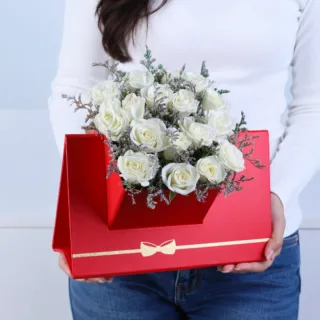 White Spray Rose Floral Envelope Box featuring 6 stems of fresh white spray roses with delicate caspia arranged in a premium red floral envelope box.