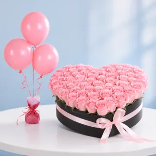 Blushing Roses & Balloons Box featuring fresh light pink roses, three matching pink balloons, and a black flower box.