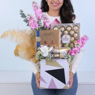 Purple flower hamper with Matthiola, white orchids, Ferrero Rocher and Lindt chocolates