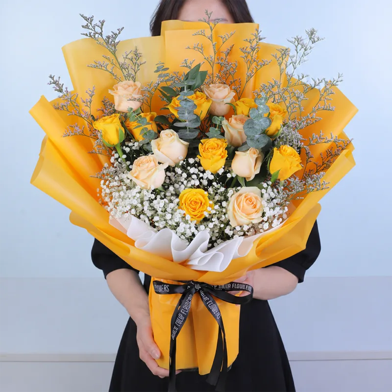 yellow-peach-rose-bouquet Yellow and peach rose bouquet featuring fresh yellow roses, peach roses, purple caspia, eucalyptus cinerea, and white gypsophila, beautifully arranged for birthdays, celebrations, friendship, and thoughtful gifting.