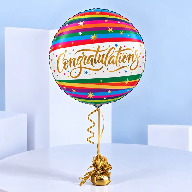 rainbow-congratulations-helium-balloon Rainbow Congratulations Helium Balloon with vibrant multicoloured stripes, gold decorative stars, and elegant lettering on a white background.
