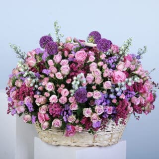 BTF Home 58 A grand, luxurious basket overflowing with roses and pastel blooms.