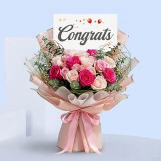 BTF Home 39 Pink roses congratulations bouquet with eucalyptus in blush pink wrap, tied with a satin ribbon and a “Congrats” card.