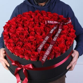 BTF Home 56 Luxury Valentine flower box featuring 100 red roses arranged in a black round box with red ribbon bow.